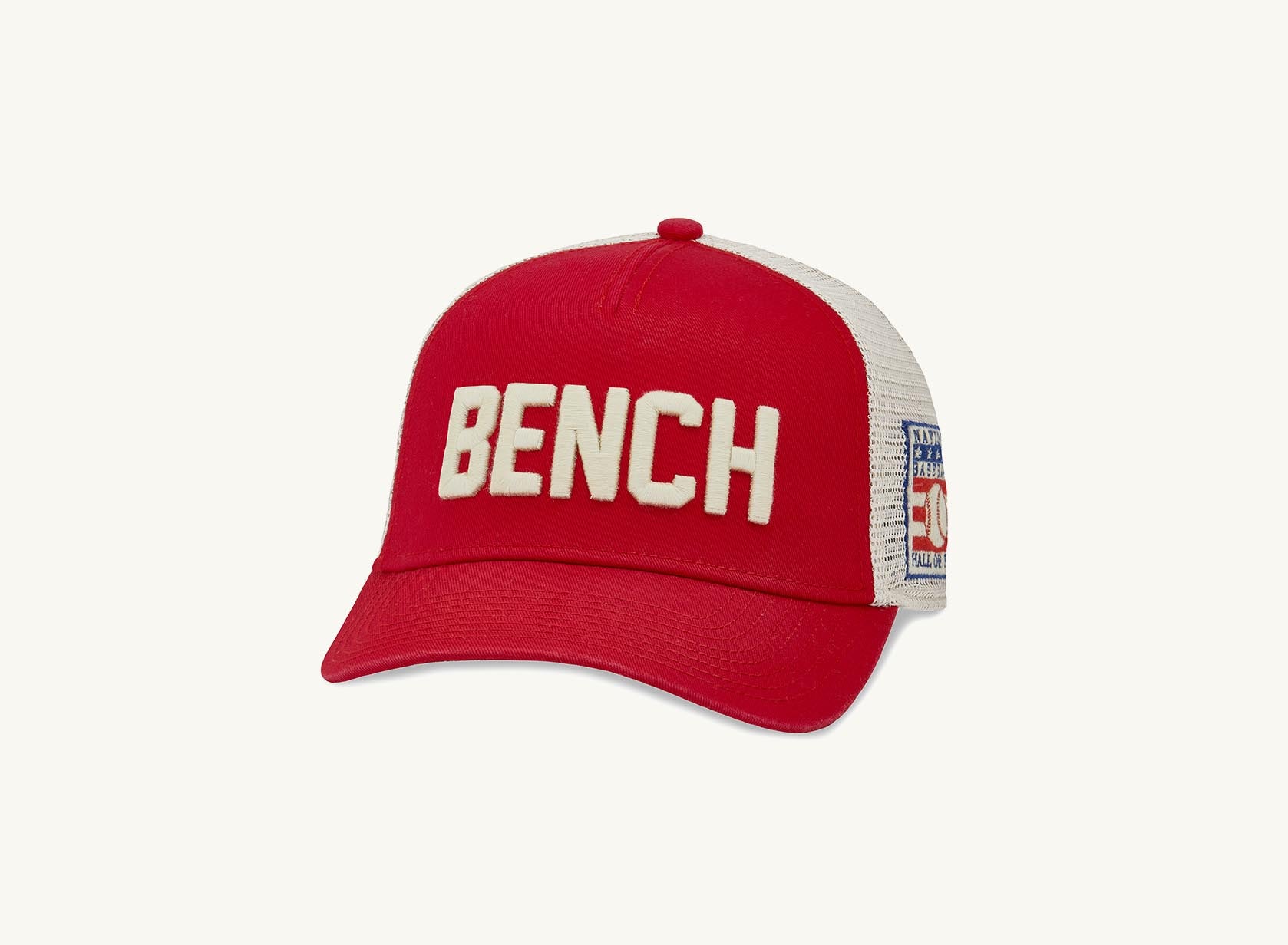red and beige bench hat